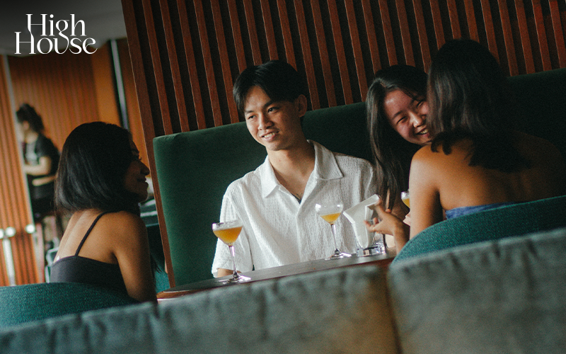 Guests enjoying drinks and conversation at a table