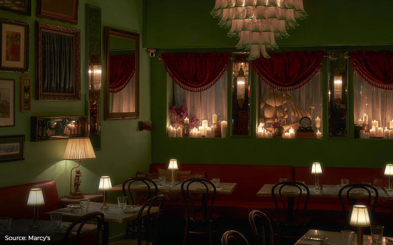Marcy's restaurant interior with green walls and candles